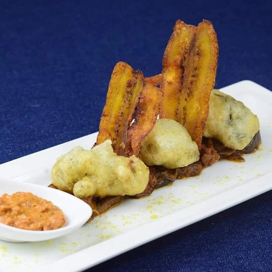 BROES CHILLI FRIED TEMPURA OYSTERS, CAPONATA, POBLANO HARISSA, PLANTAIN CHIPS, LEMON SALT